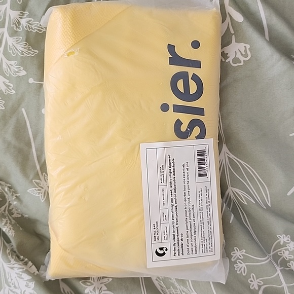 Glossier Handbags - Glossier yellow duffel bag